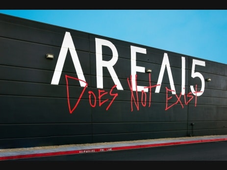 AREA15 exterior wall in Las Vegas with logo and Does Not Exist graffiti art