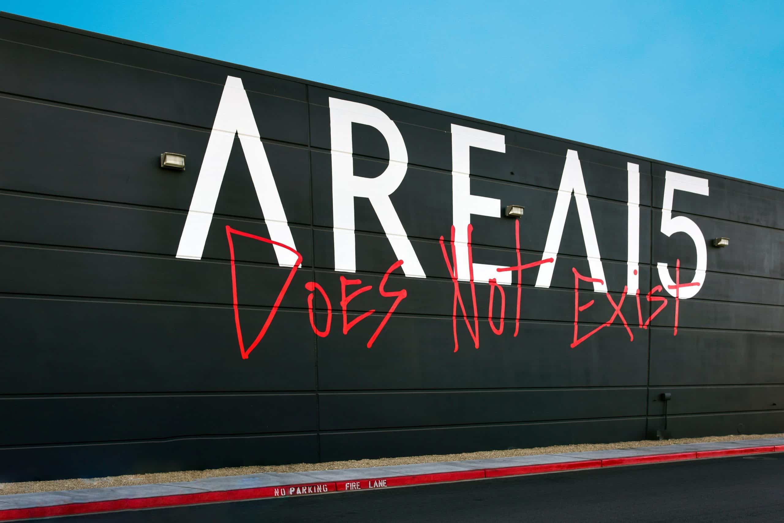 AREA15 exterior wall in Las Vegas with logo and Does Not Exist graffiti art
