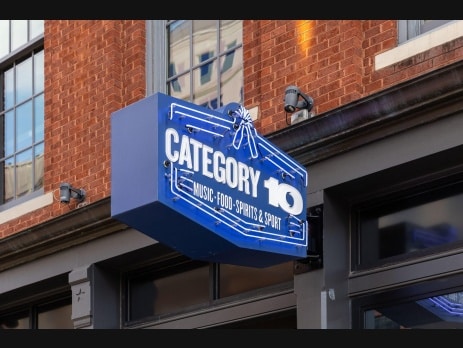 The Category 10 neon sign on a brick corner building in Las Vegas
