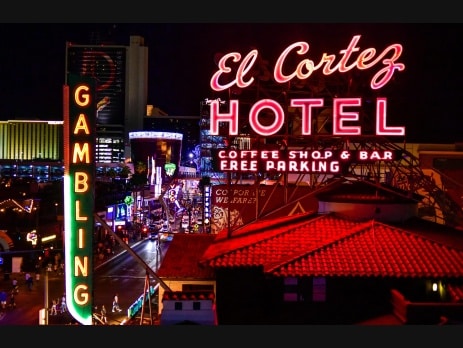 The El Cortez Hotel neon sign glowing at night above the Fremont Street casino district in downtown Las Vegas