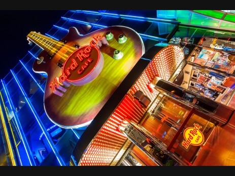 Hard Rock Cafe neon guitar sign lit at night on the Las Vegas Strip