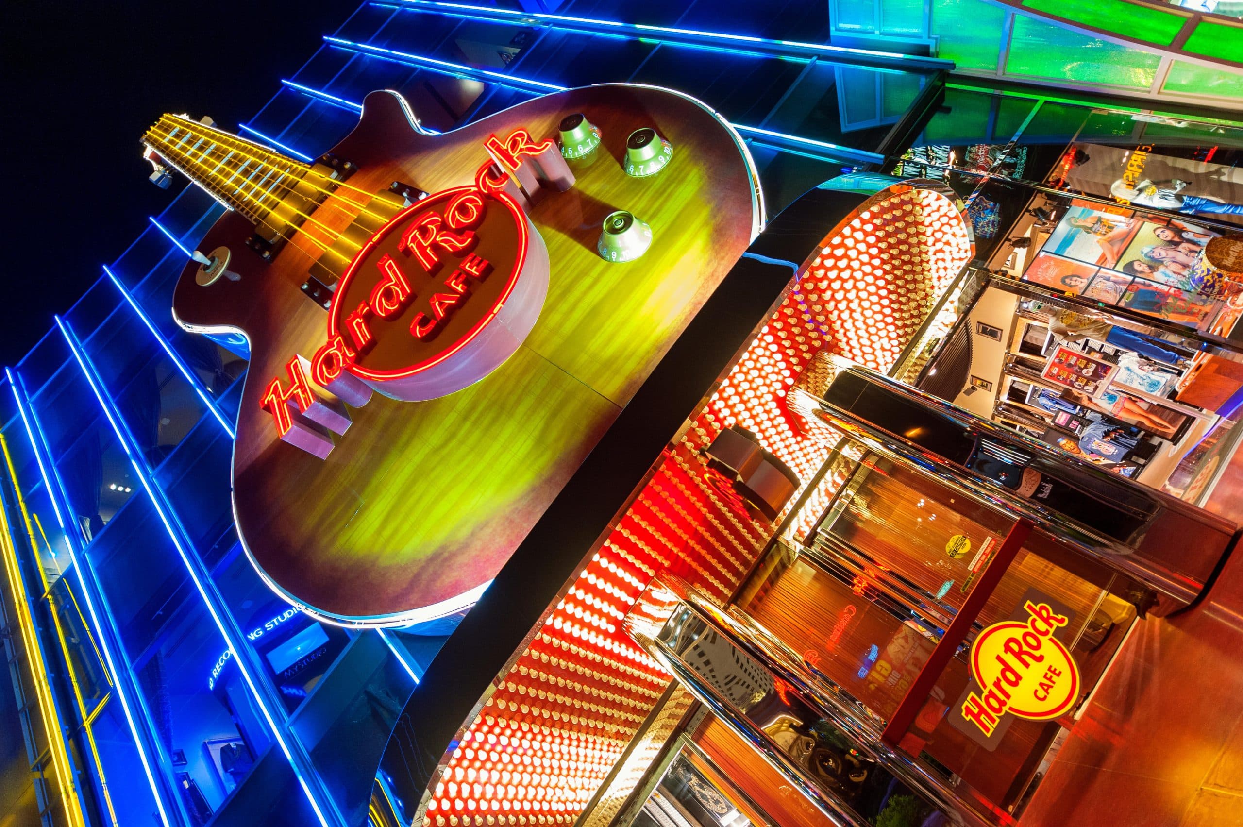 Hard Rock Cafe neon guitar sign lit at night on the Las Vegas Strip
