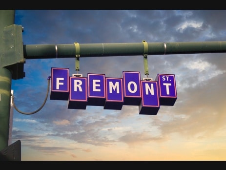 Fremont Street sign hanging over the street in downtown Las Vegas at dusk