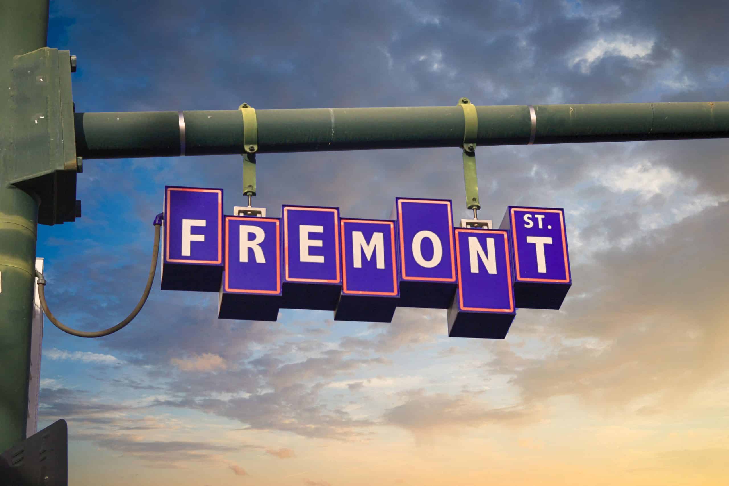 Fremont Street sign hanging over the street in downtown Las Vegas at dusk