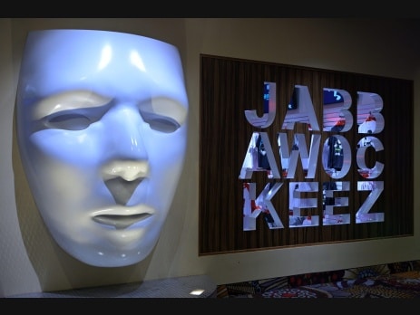 Jabbawockeez white mask display and branded sign at MGM Grand Las Vegas