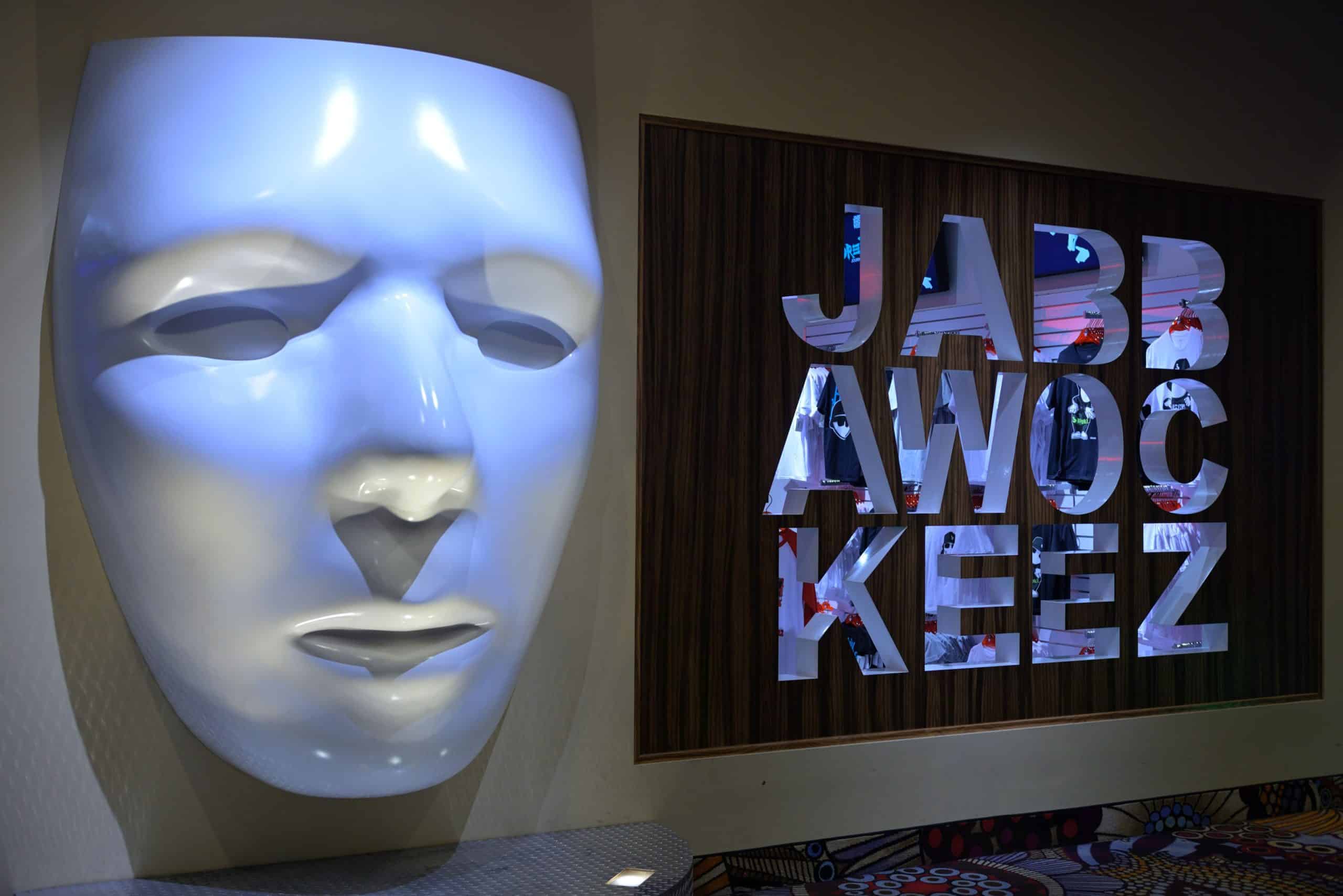 Jabbawockeez white mask display and branded sign at MGM Grand Las Vegas