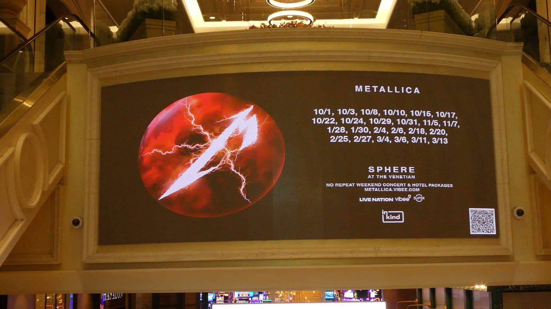 Metallica Life Burns Faster residency advertisement on a display screen inside the Venetian resort showing all 24 show dates and Sphere at the Venetian branding