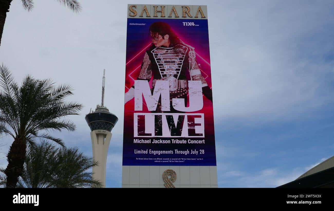 MJ Live Las Vegas billboard on the exterior of the Sahara hotel featuring a Michael Jackson tribute performer in a bejeweled concert jacket